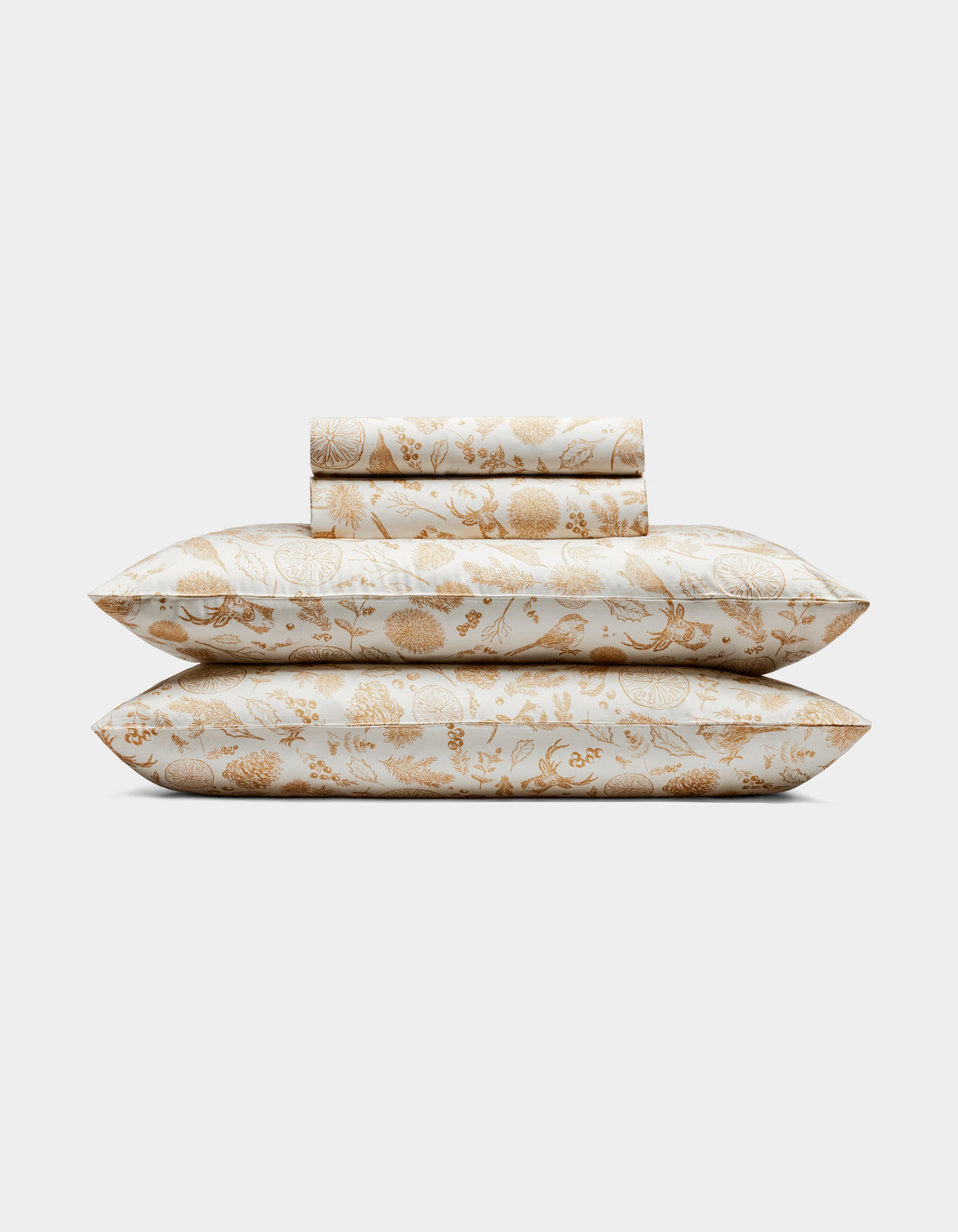 The Cozy Earth Bamboo Sheet Set includes two pillows and folded sheets with an intricate gold floral botanical pattern on a white background.|Color:Winter Toile Dijon