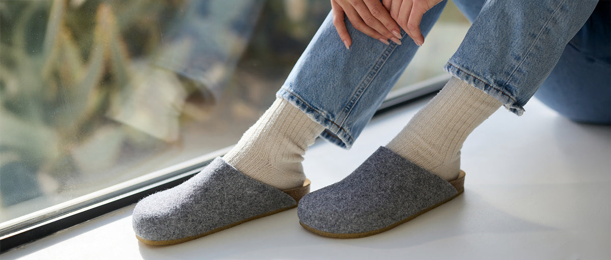 a pair of woman's feet wearing Cozy Earth Lakehouse Clog 