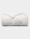 The Cozy Earth Down Alternative Comforter is neatly folded and fluffy, displayed against a plain light gray background. |Filling:Standard