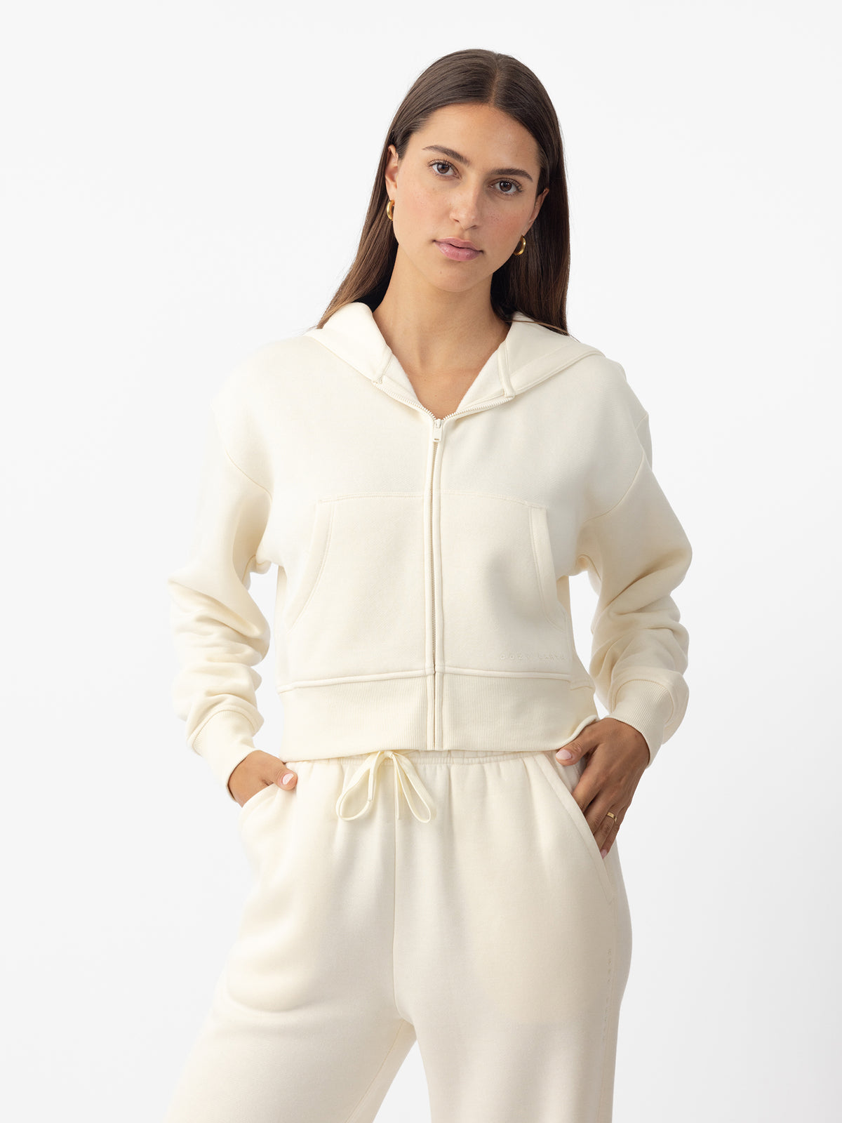 Woman wearing Alabaster CityScape Cropped Full Zip with white background 