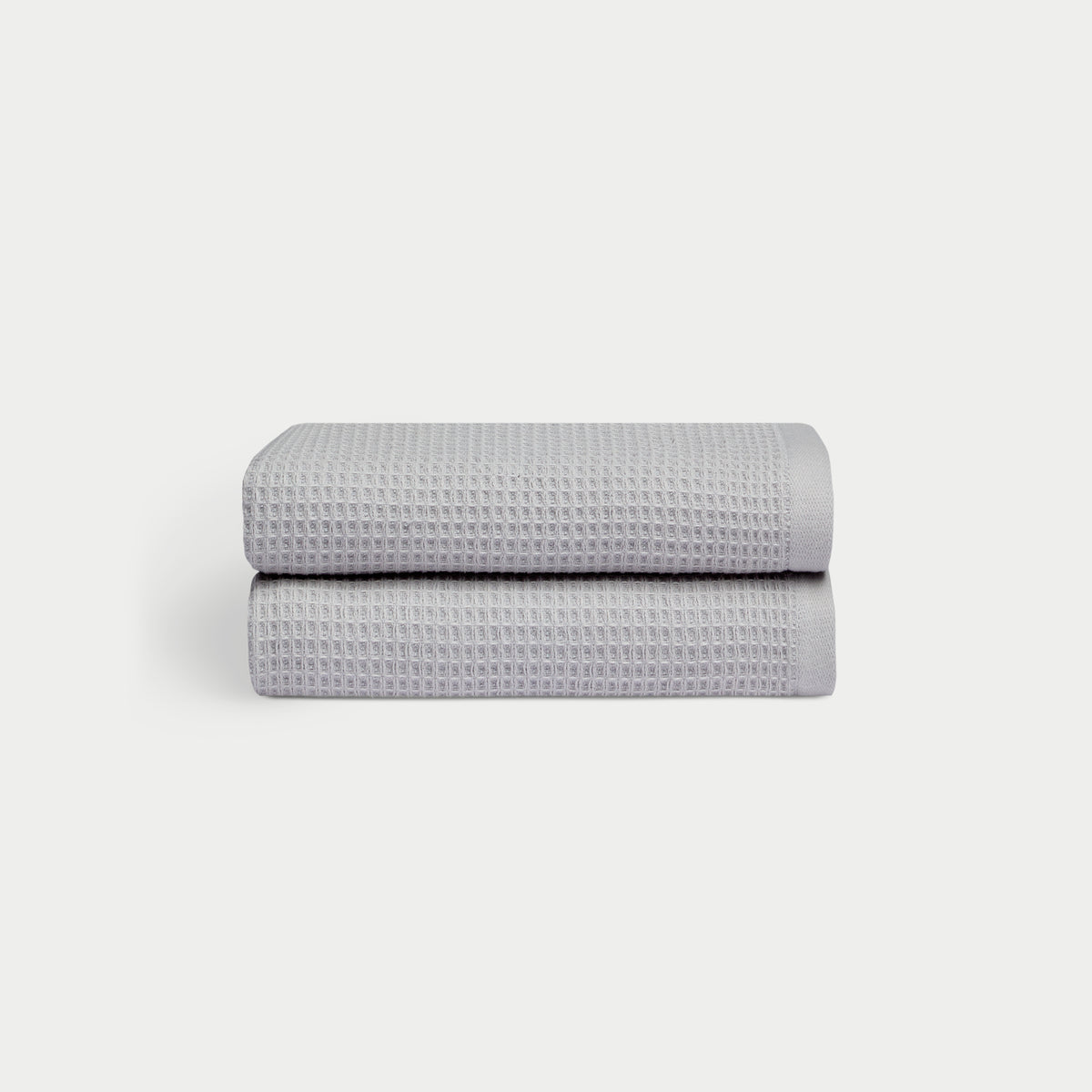 Harbor Mist Waffle Hand Towel set neatly folded. The photo was taken with a white background. 