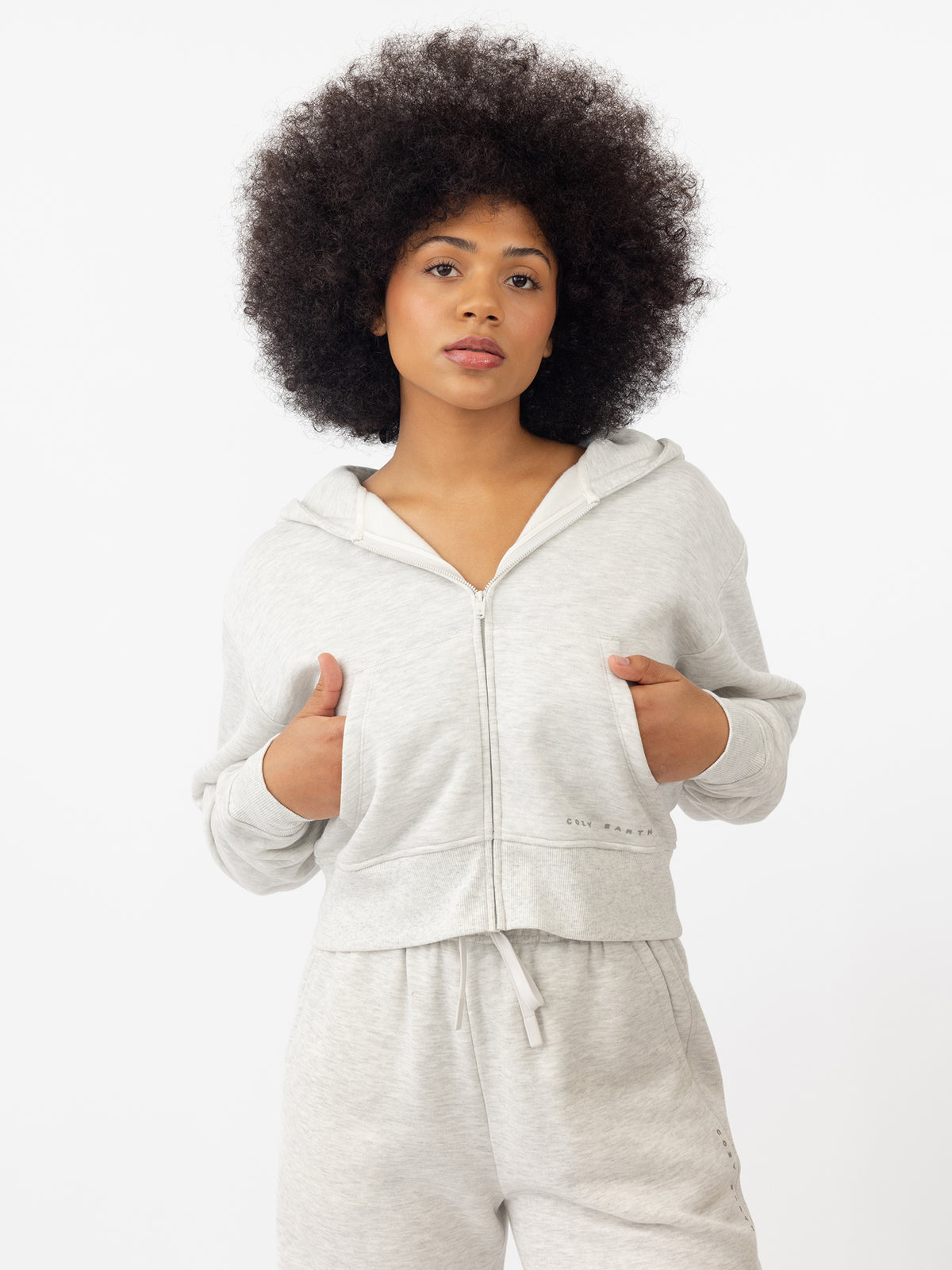 Woman wearing Heather Grey CityScape Cropped Full Zip with white background 