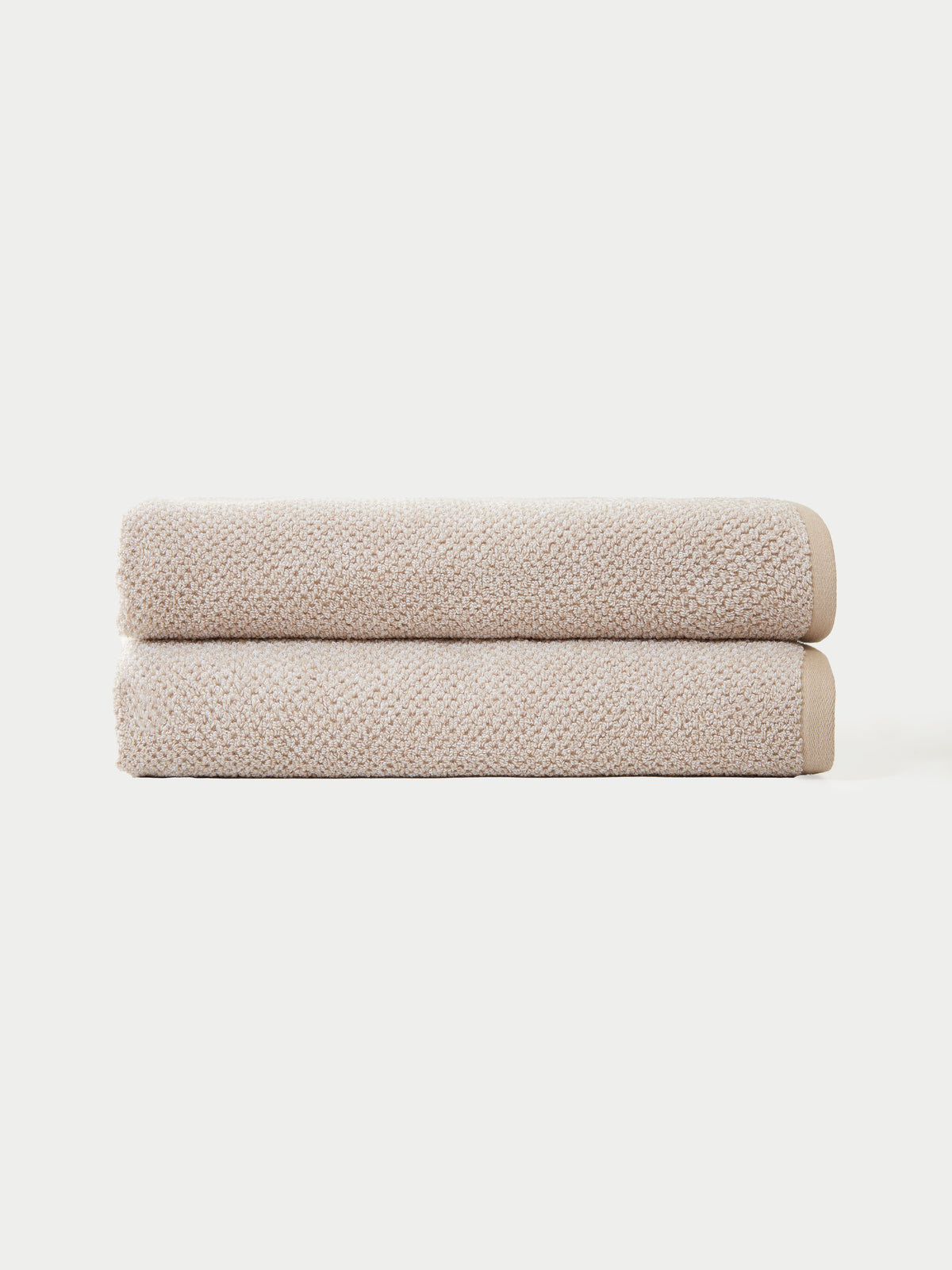Nantucket Bath Sheets in the color Heathered Sand. The bath sheets are neatly folded. The photo of the bath sheets was taken with a white background.