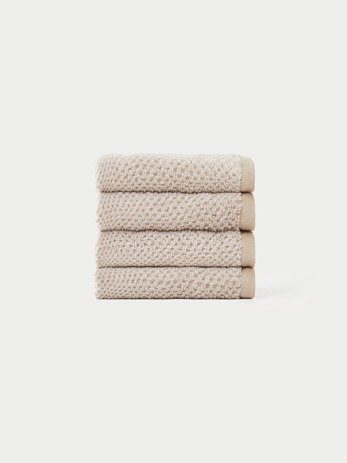 Nantucket Wash Cloths in the color Heathered Sand. The Wash Cloths are neatly folded. The photo of the wash cloths was taken with a white background.