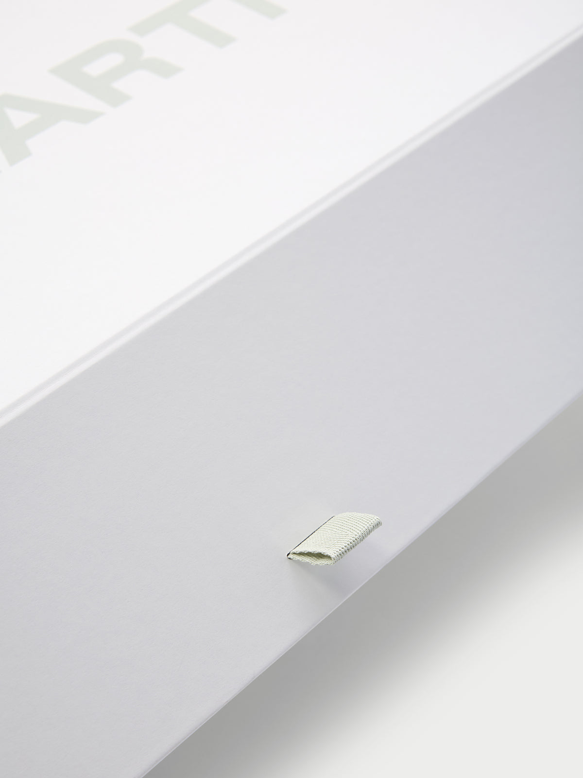 Close up of tab on gift box 