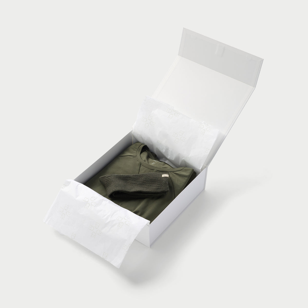 Small open gift box with cozy earth products inside 