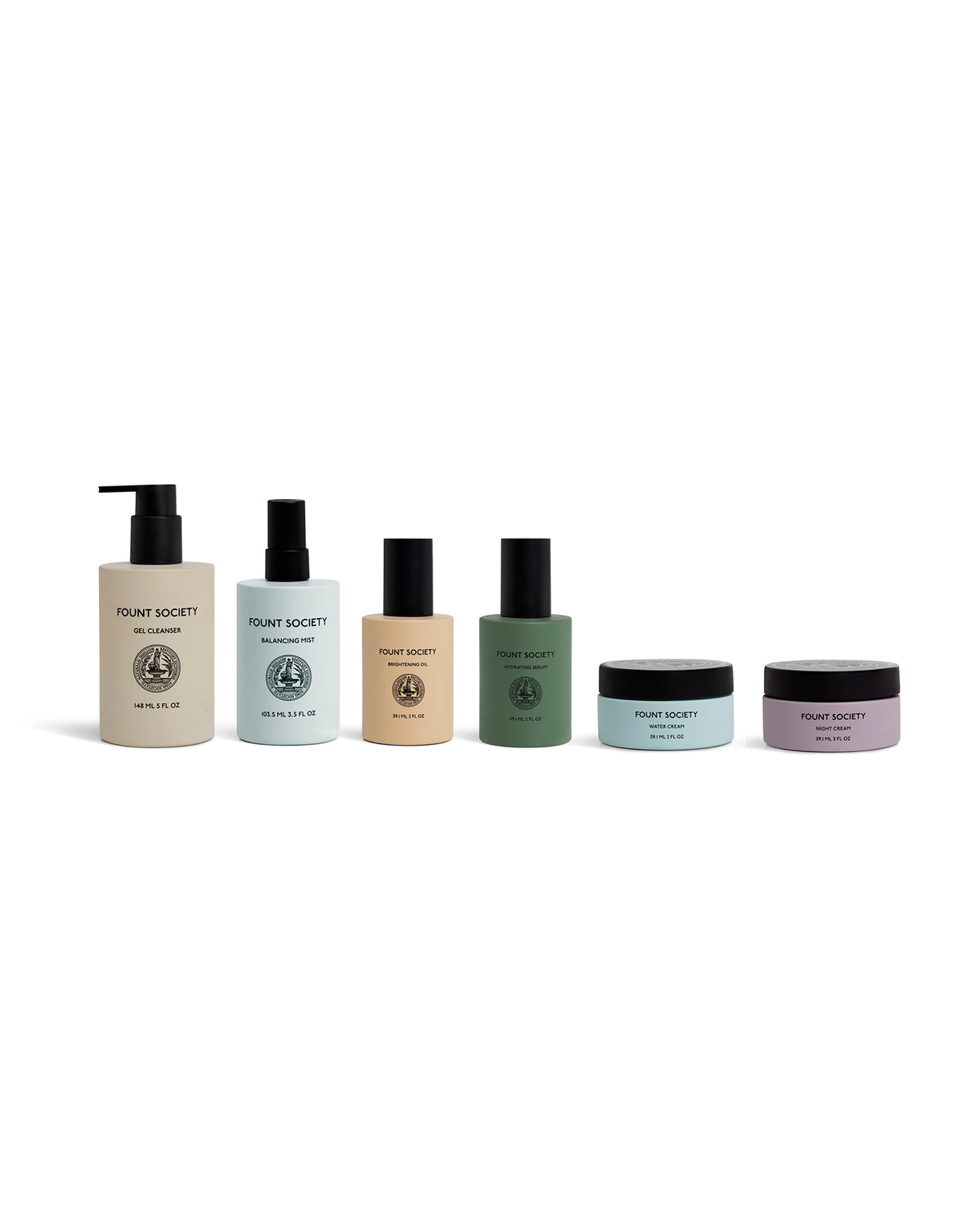 Six Cozy Earth Day-to-Night Essentials skincare products in pastel-colored bottles and jars, featuring pumps, sprays, and screw-top containers, arranged in a row against a white background.