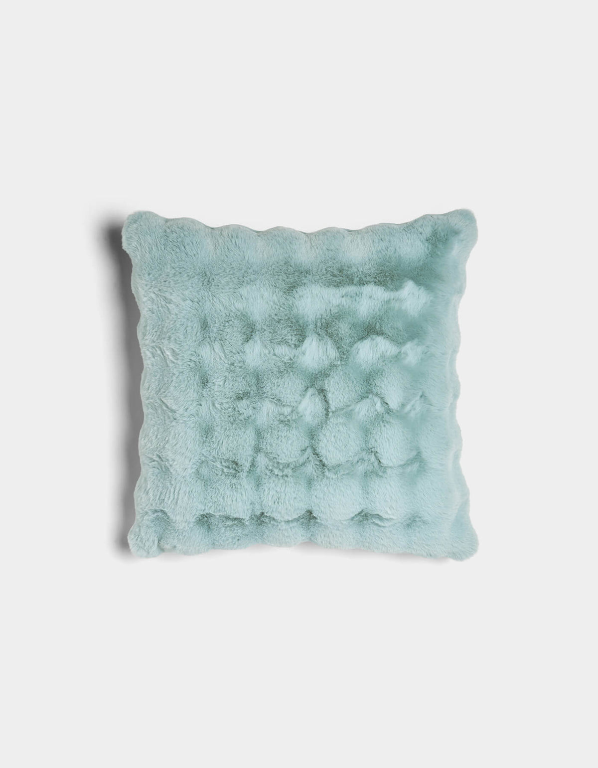 The Bubble Cuddle Pillow by Cozy Earth is a square, light blue faux fur pillow with a wavy texture and scalloped edges, displayed against a white background.|Color:Tide |Size:20" x 20"