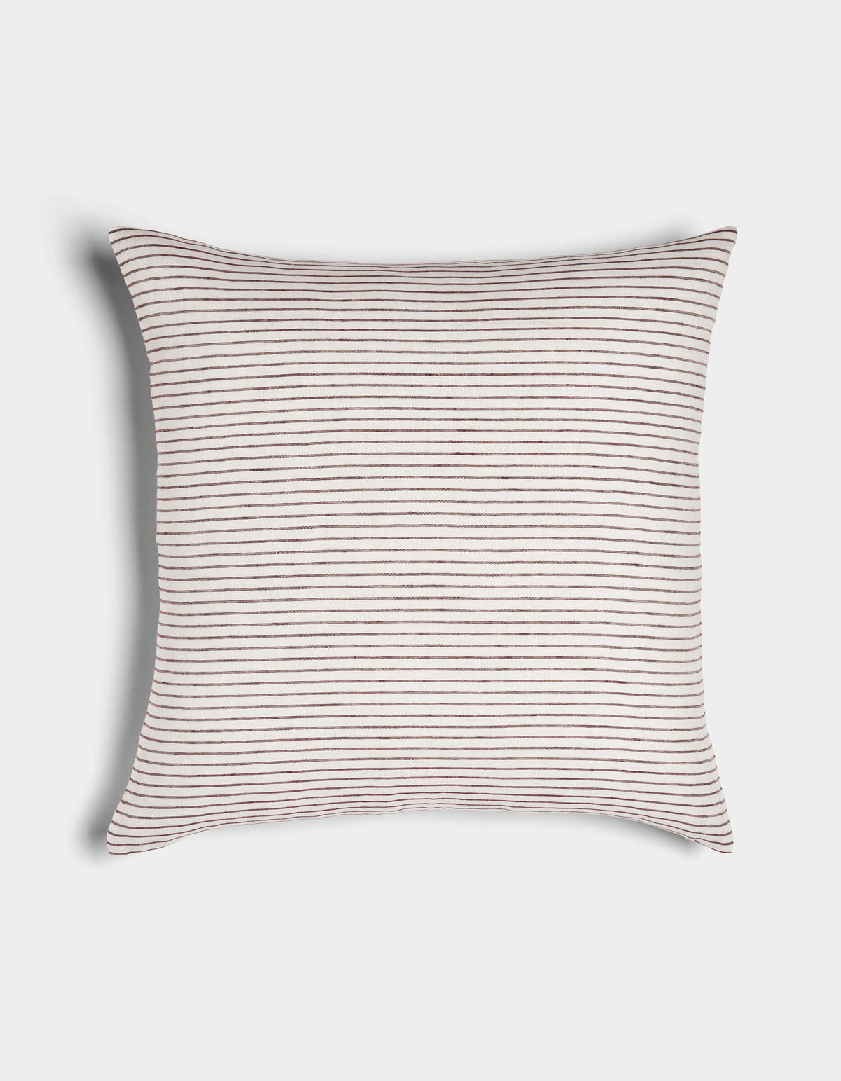 The Cozy Earth Striped Throw Pillow features a soft white fabric with thin, evenly spaced horizontal brown stripes and gently curved edges, displayed on a plain white surface.