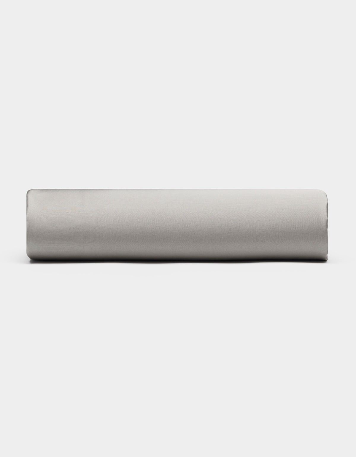 A Bamboo Fitted Sheet by Cozy Earth in light gray is displayed from the side against a plain white background.