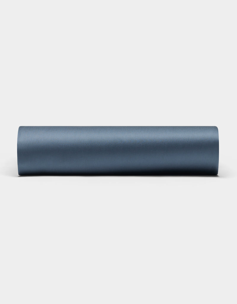 A Bamboo Fitted Sheet by Cozy Earth is laid out on a plain white background.