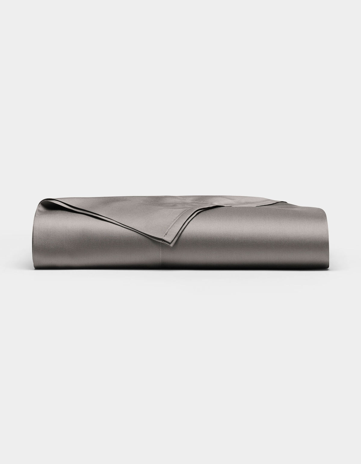 A neatly folded, smooth Cozy Earth Bamboo Flat Sheet in grey is displayed against a plain white background.|Color:Charcoal