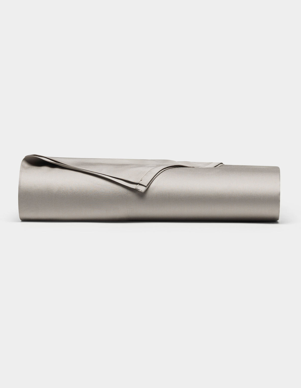 The Cozy Earth Bamboo Flat Sheet, in light gray, is neatly rolled and displayed on a plain white background.