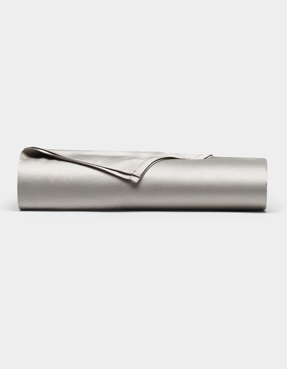 The Cozy Earth Bamboo Flat Sheet, shown in light gray with one corner folded over, is neatly rolled up and displayed against a plain white background.|Color:Light Grey