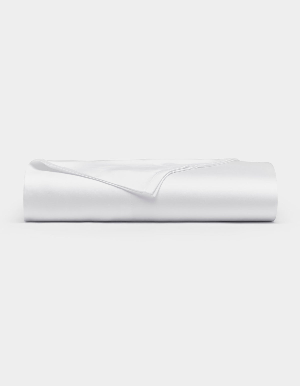 A neatly folded Cozy Earth Bamboo Flat Sheet in white rests on a flat surface against a plain white background.|Color:White