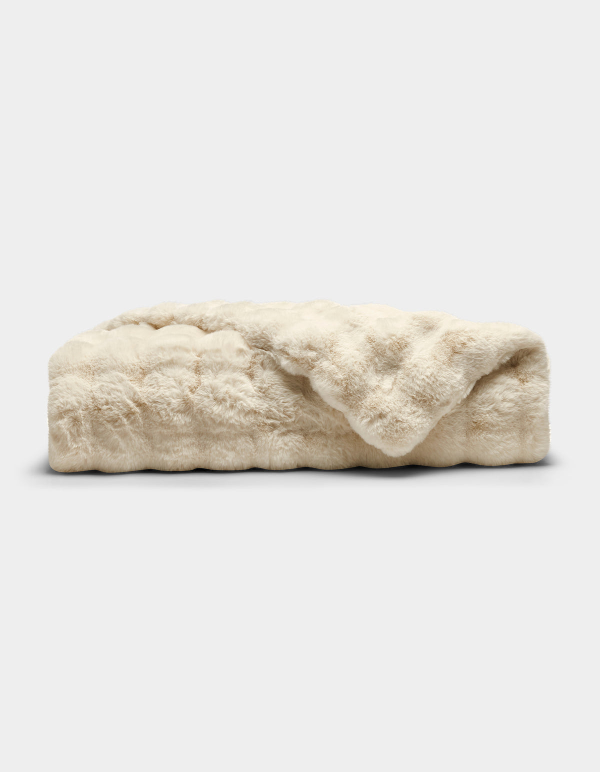 The Cozy Earth Bubble Cuddle Blanket is a folded, cream-colored faux fur throw with a soft, plush texture, shown against a plain white background.|Color:Creme