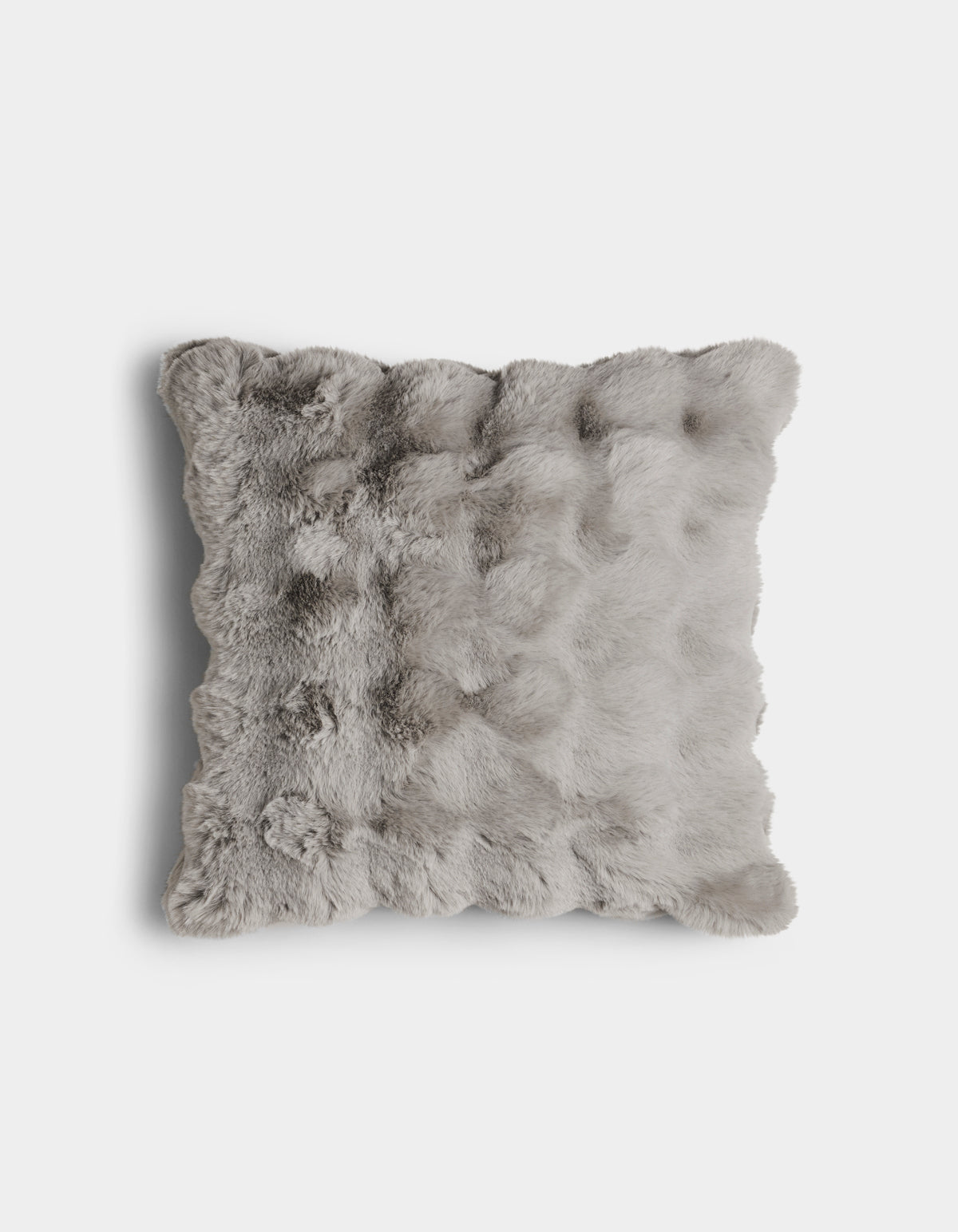 The Bubble Cuddle Pillow by Cozy Earth is a square, light gray faux fur pillow with a soft, fluffy texture, displayed against a plain white background.