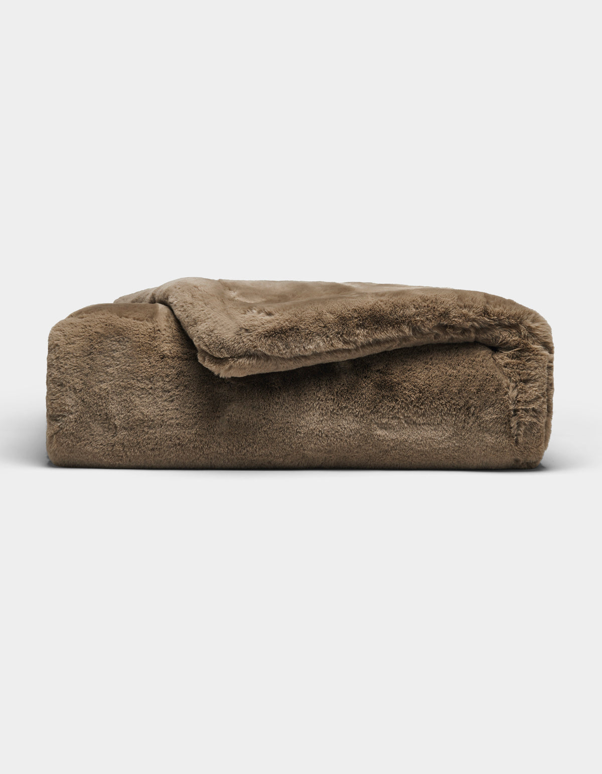 The Cozy Earth Cuddle Blanket, featuring a plush brown fabric and soft, fuzzy texture, is shown folded against a plain white background.|Color:Walnut