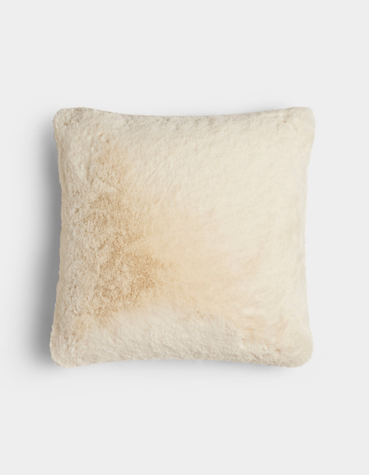 The Cuddle Pillow by Cozy Earth is a square, cream-colored, fluffy pillow featuring a light tan stain on the left side, shown against a plain white background.|Color:Creme |Size:24" x 24"