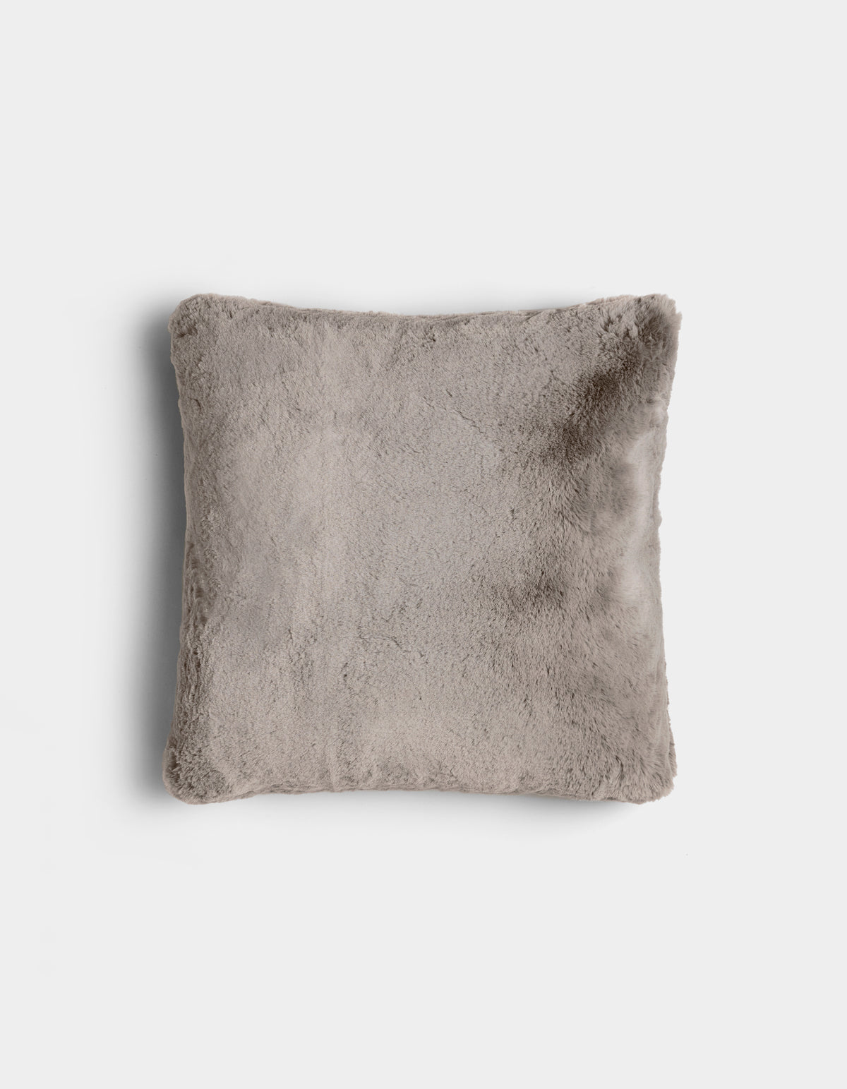 The Cuddle Pillow by Cozy Earth is a square, light gray plush pillow with a soft, fuzzy texture, displayed on a plain white background.