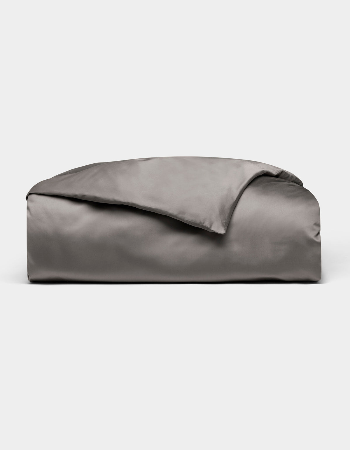 A neatly folded, shiny gray Bamboo Duvet Cover by Cozy Earth is displayed on a plain white background.