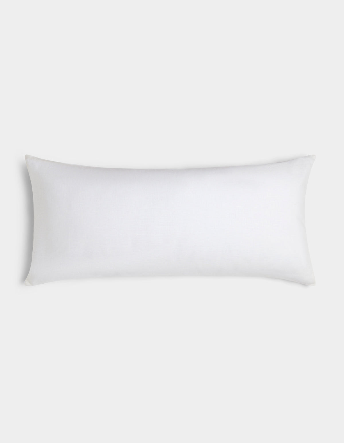 The Cozy Earth Linen Throw Pillow, featuring a simple white rectangular design, is displayed against a light gray background. 