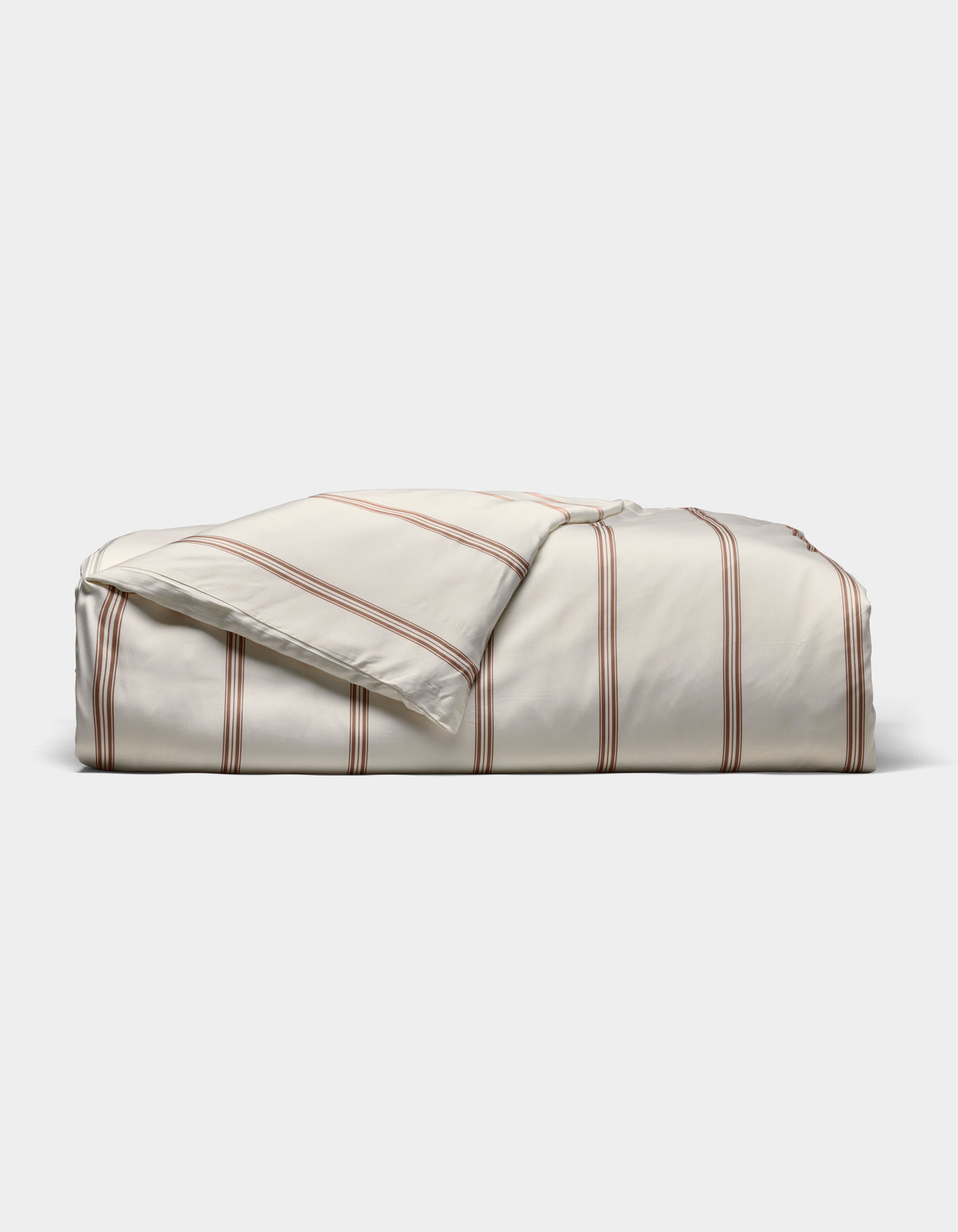 The Cozy Earth Bamboo Duvet Cover, in cream with thin red stripes, is shown neatly folded against a plain white background.