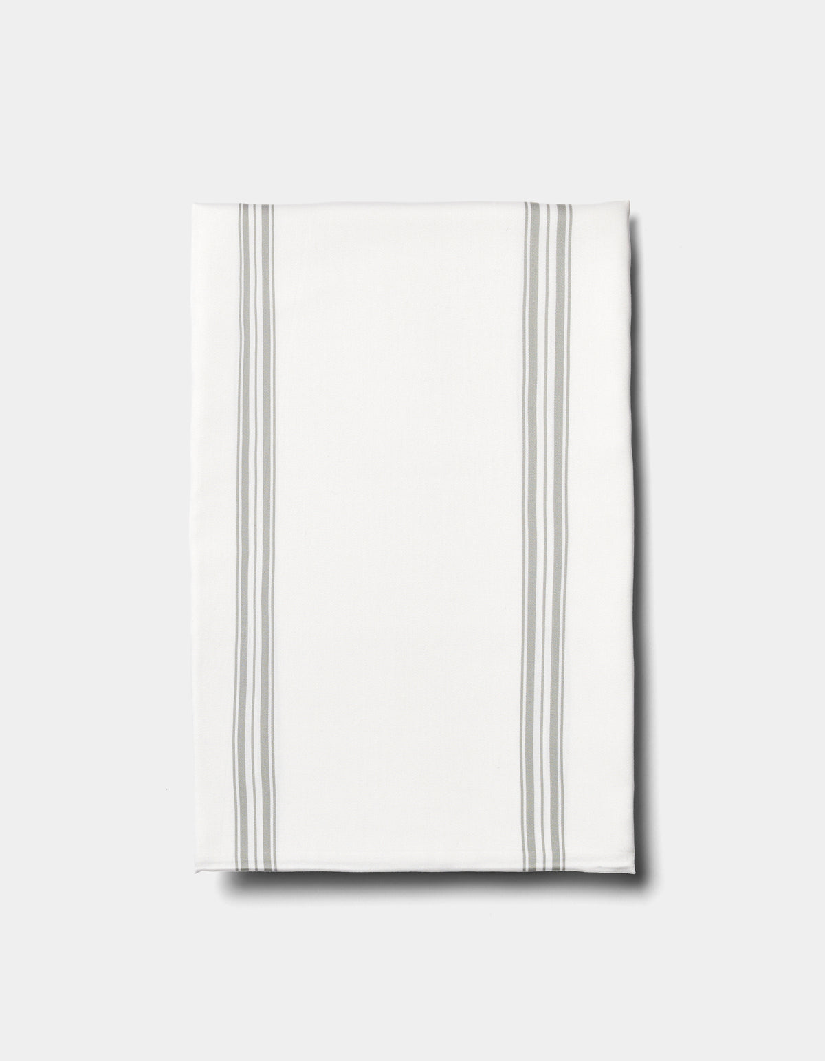 The Cozy Earth Bamboo Sheet Set is displayed on a plain light background, featuring neatly folded white fabric with two pairs of parallel light gray stripes running vertically near the edges.