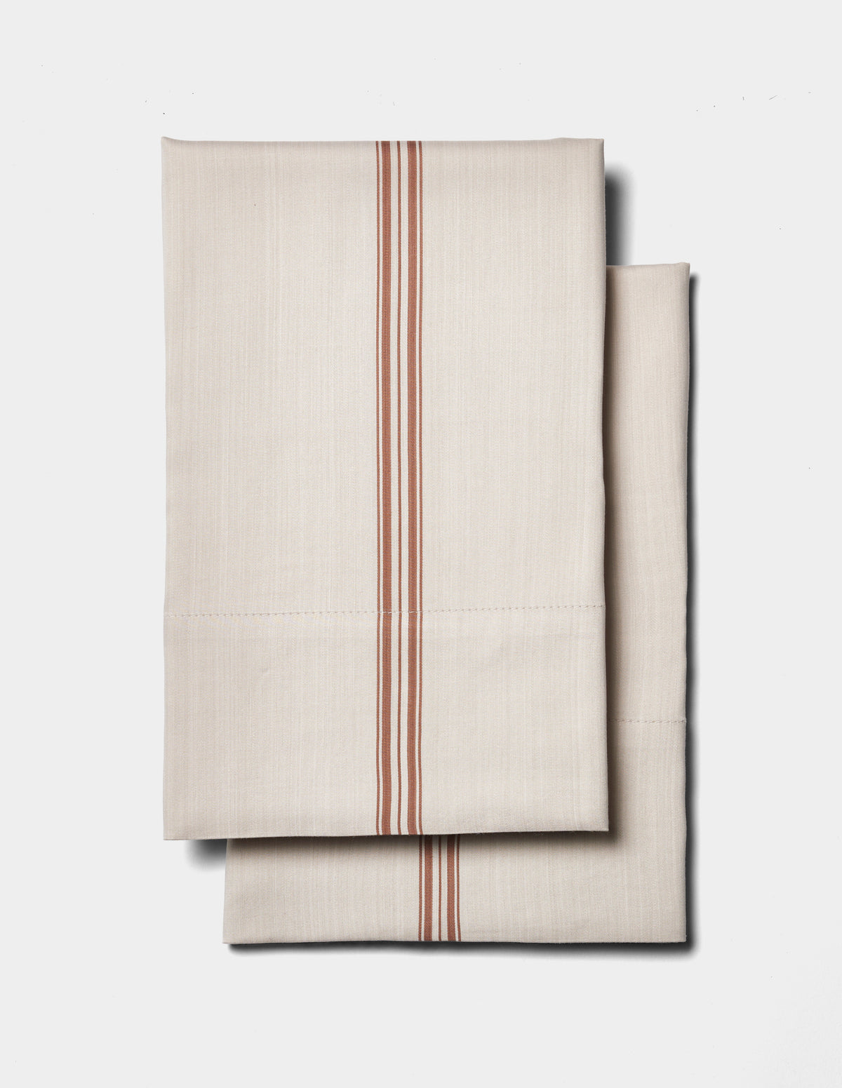 The Cozy Earth Bamboo Sheet Set features a beige design with parallel red stripes down the center, displayed on a plain white background.