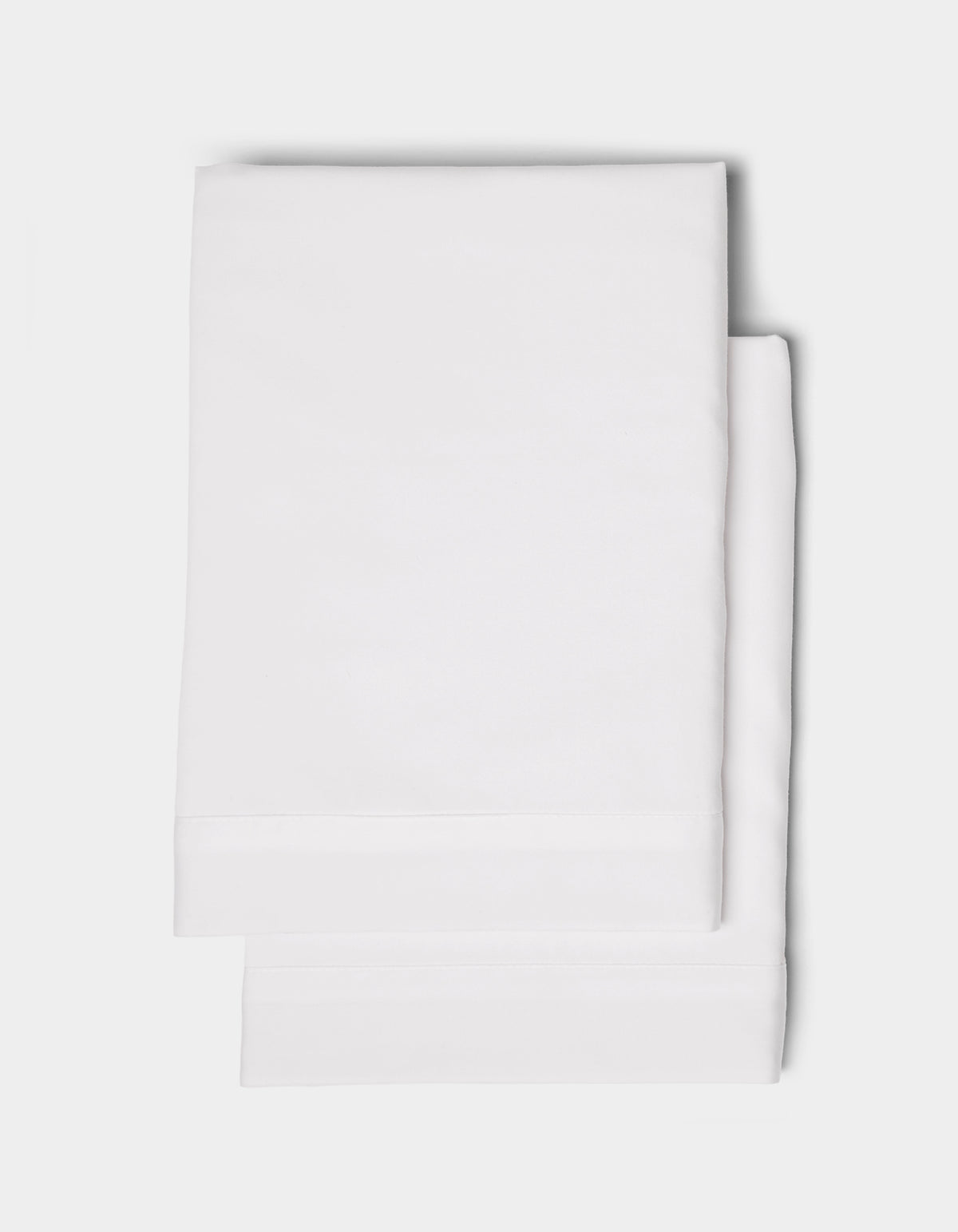 Two neatly folded Cozy Earth Soft-Wash Cotton Shams stacked on a plain white background.