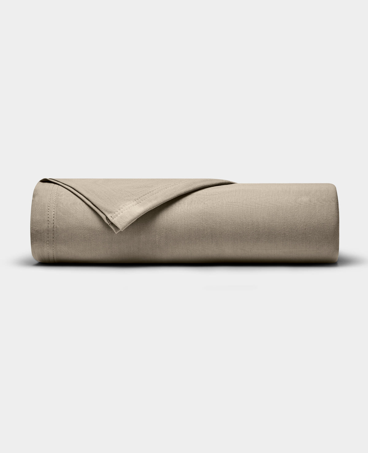 A Cozy Earth Bamboo Jersey Flat Sheet in beige is neatly folded and displayed on a plain, light gray background.|Color:Driftwood