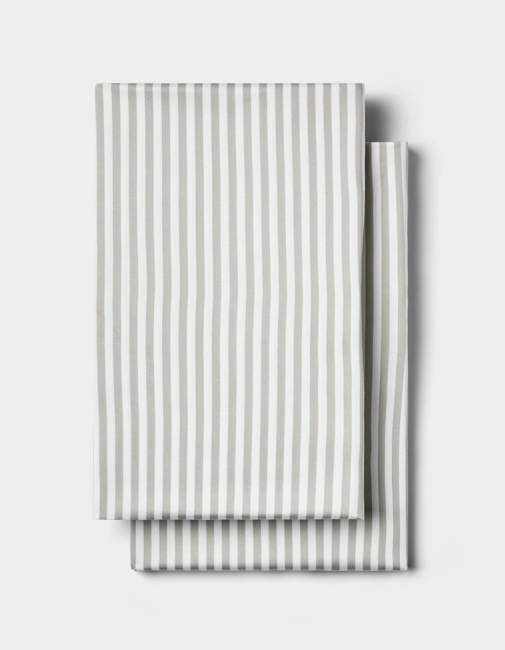 Two neatly folded Cozy Earth Bamboo Pillowcases in white with vertical light gray stripes, displayed on a plain white background.