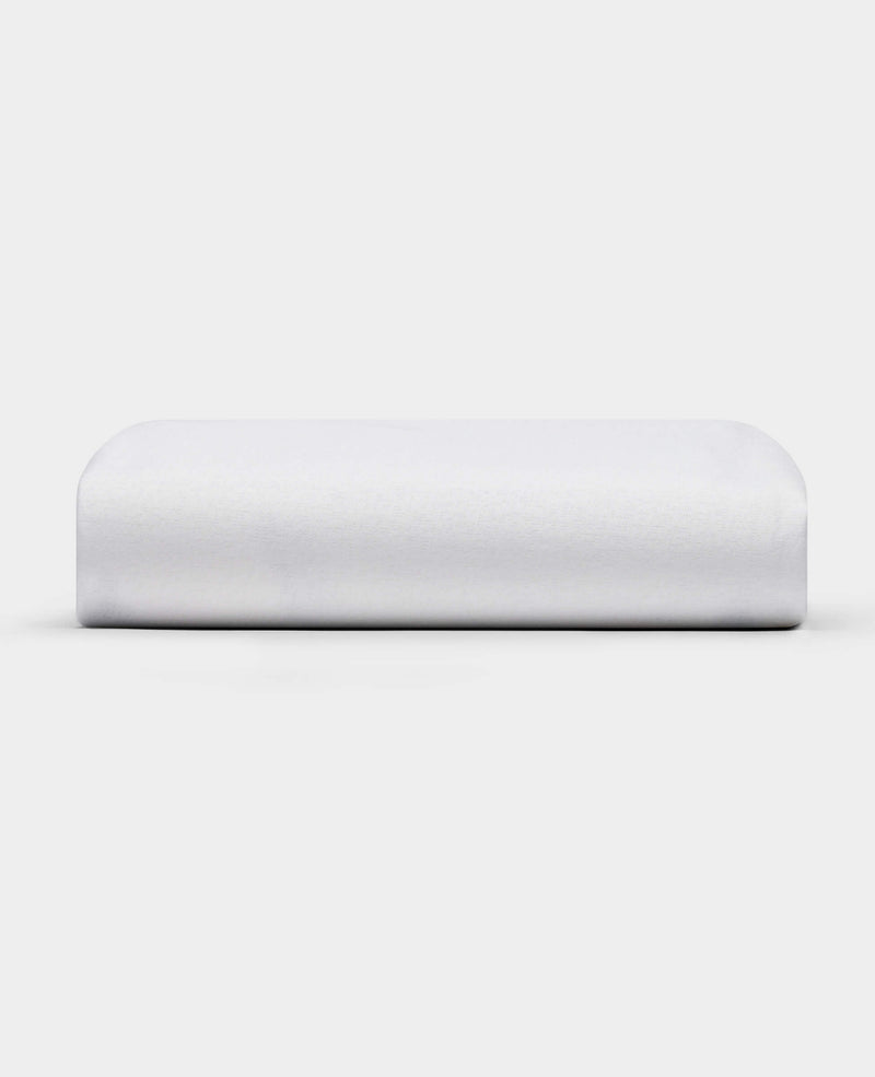 The Cozy Earth Cooling Mattress Protector is shown against a plain white background. It appears firm, rectangular with smooth, rounded edges, and has a crisp white finish.