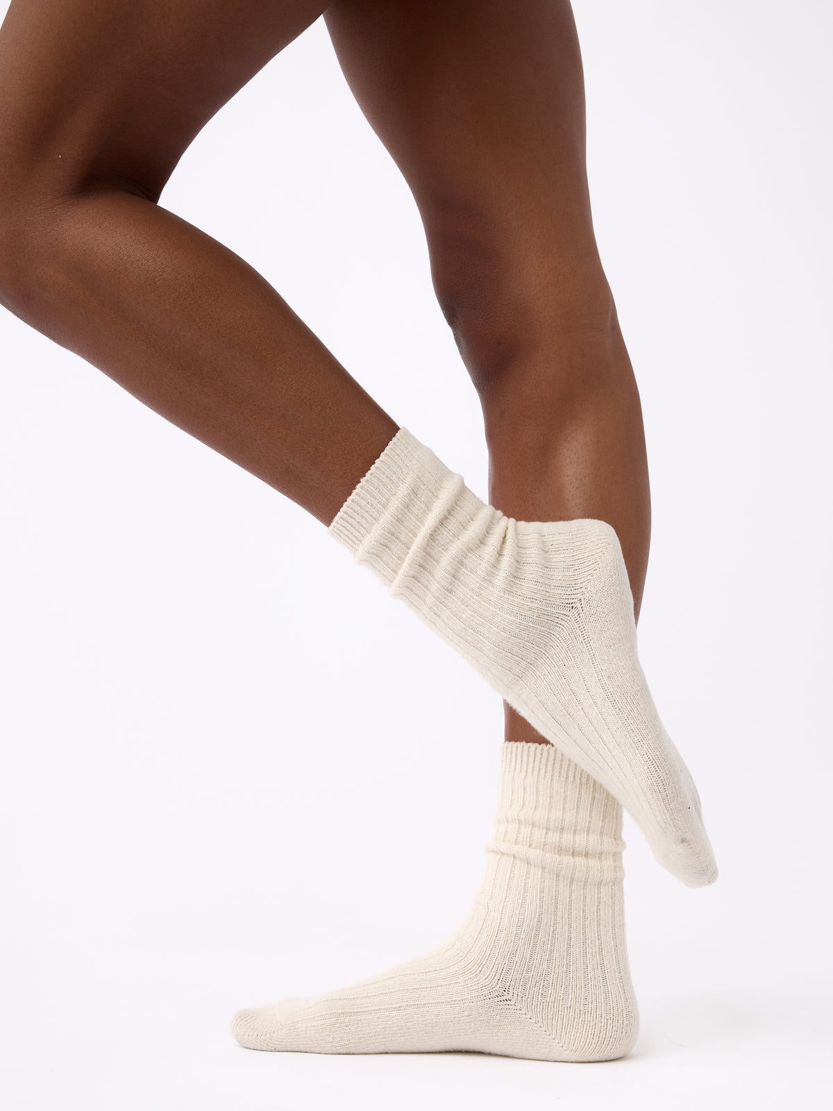 Person wearing Cozy Earth Plush Lounge Calf Sock 1-Pack in Alabaster 