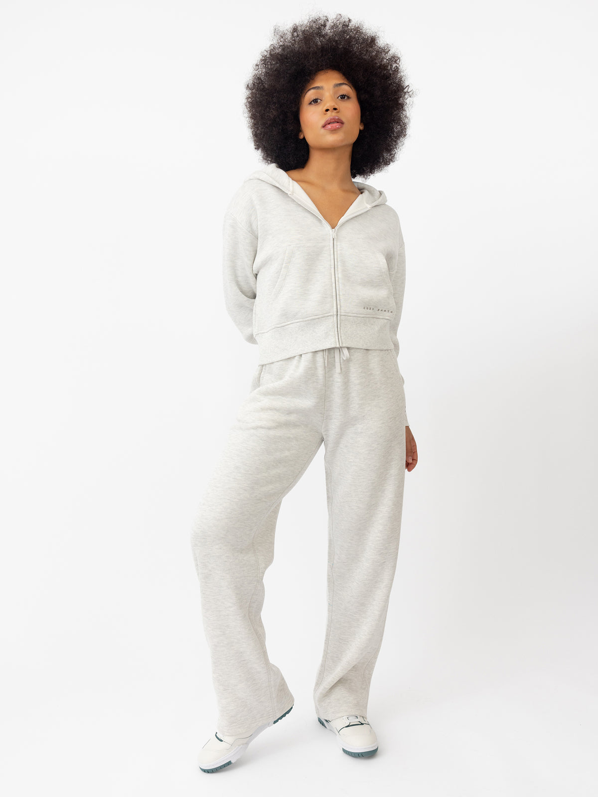 Woman wearing Heather Grey CityScape Cropped Full Zip with white background 