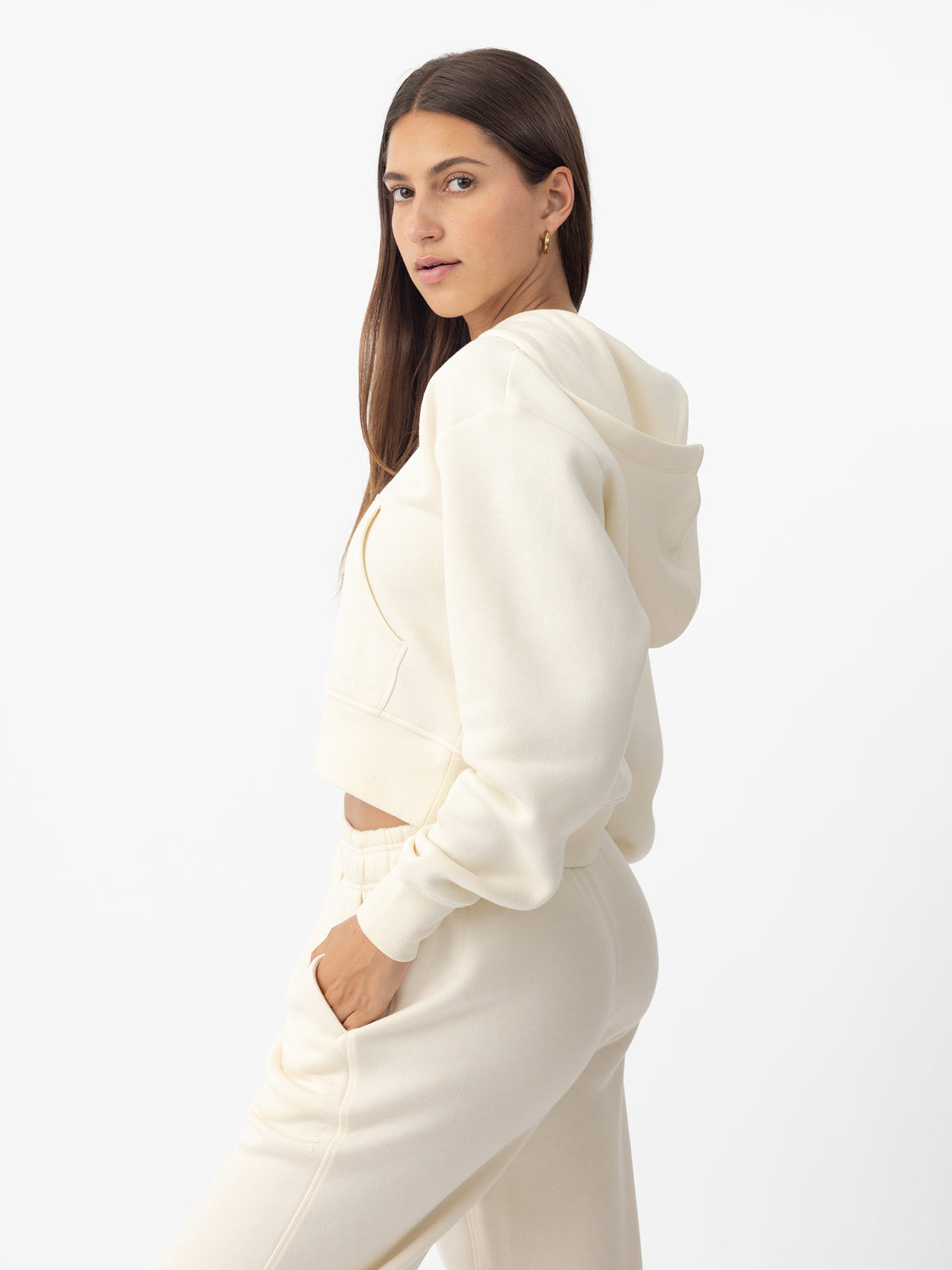 Woman wearing Alabaster CityScape Cropped Full Zip with white background 