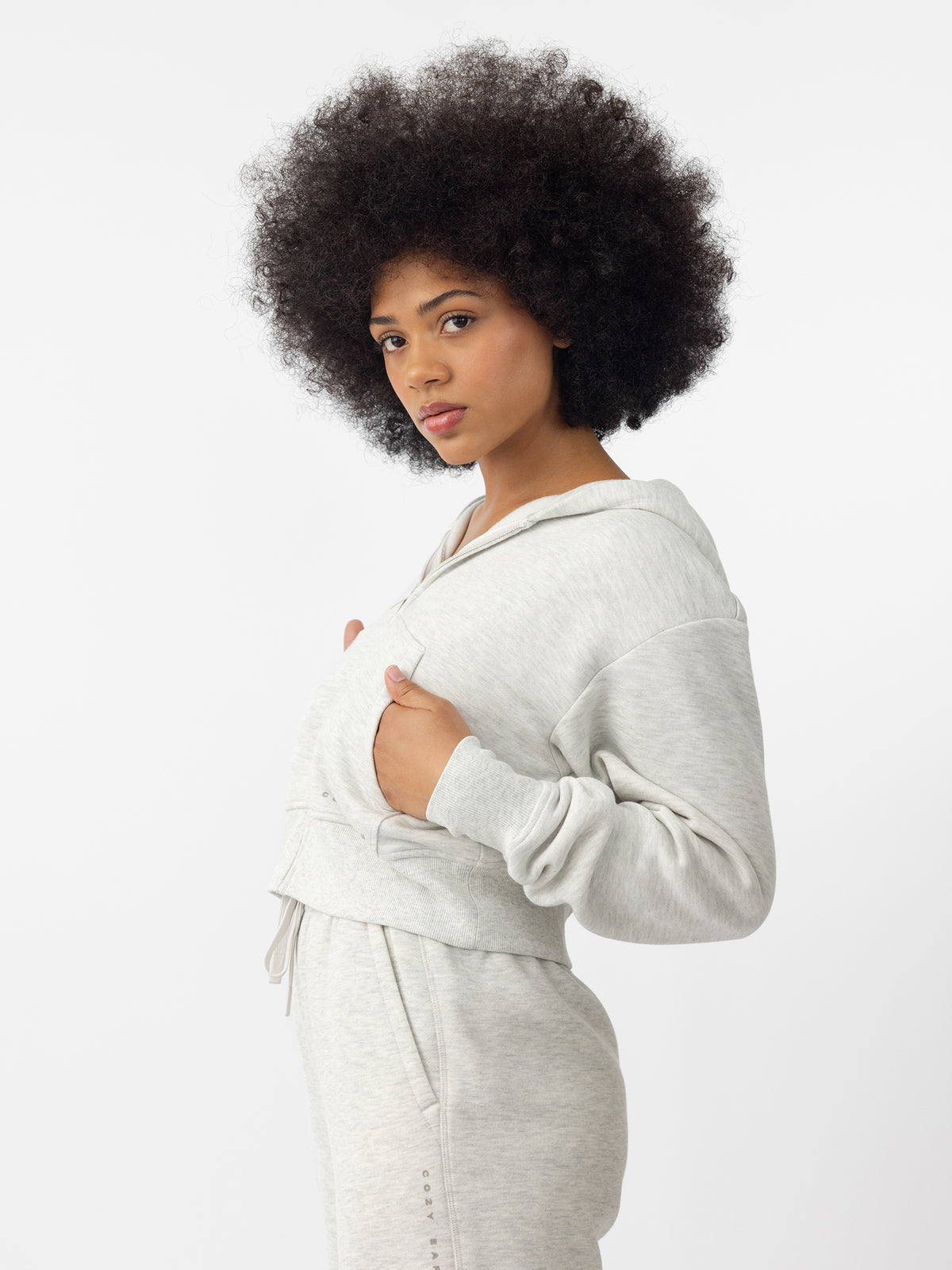 Woman wearing Heather Grey CityScape Cropped Full Zip with white background 