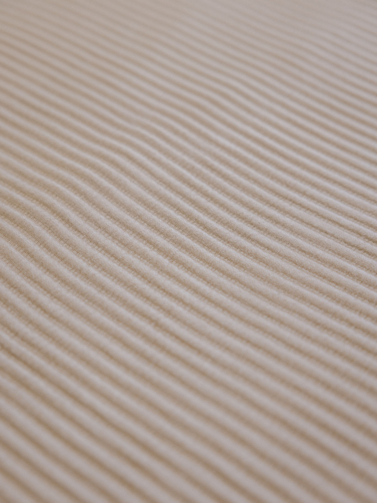 Close up of driftwood coverlet fabric 