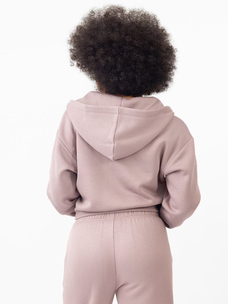 Woman wearing Dusty Orchid CityScape Cropped Full Zip with white background