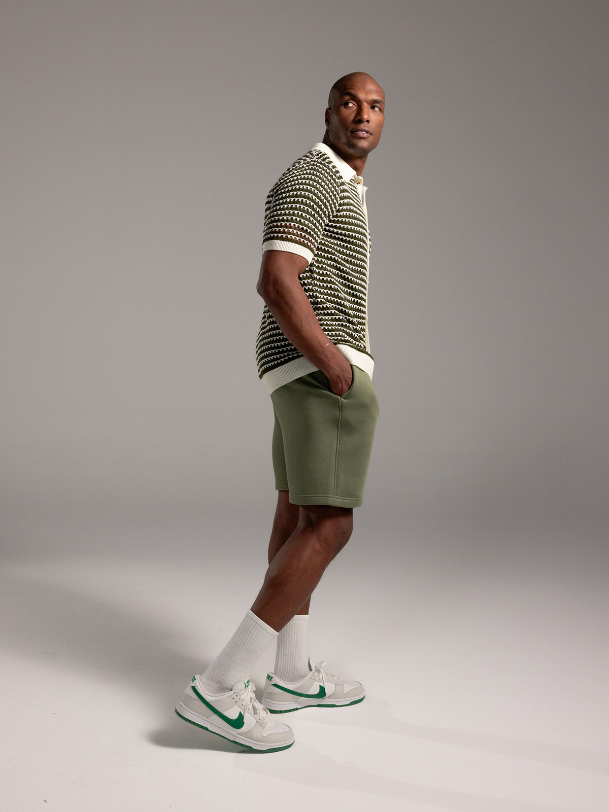 Man wearing Juniper CityScape Shorts with grey background 