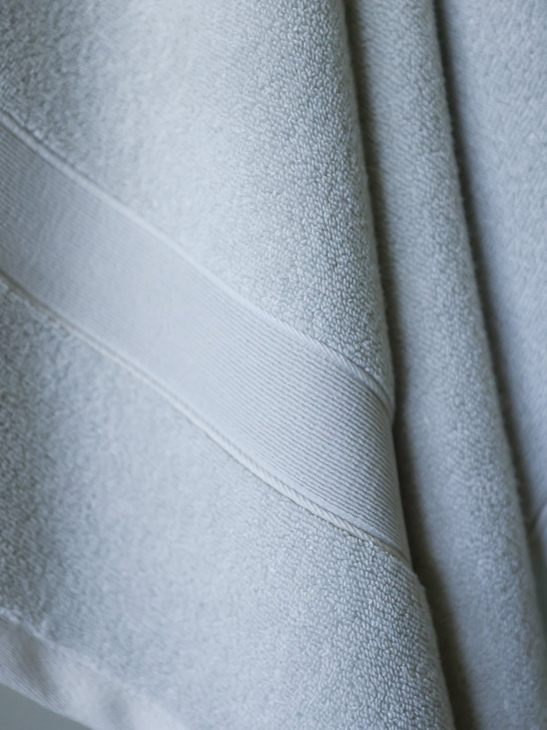 Close up of light grey luxe bath towel 