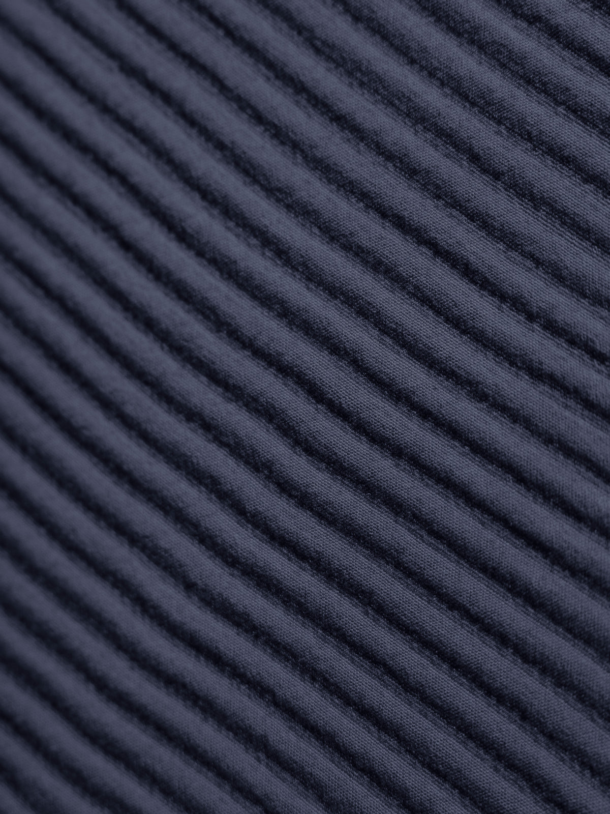 Close up of navy coverlet fabric 