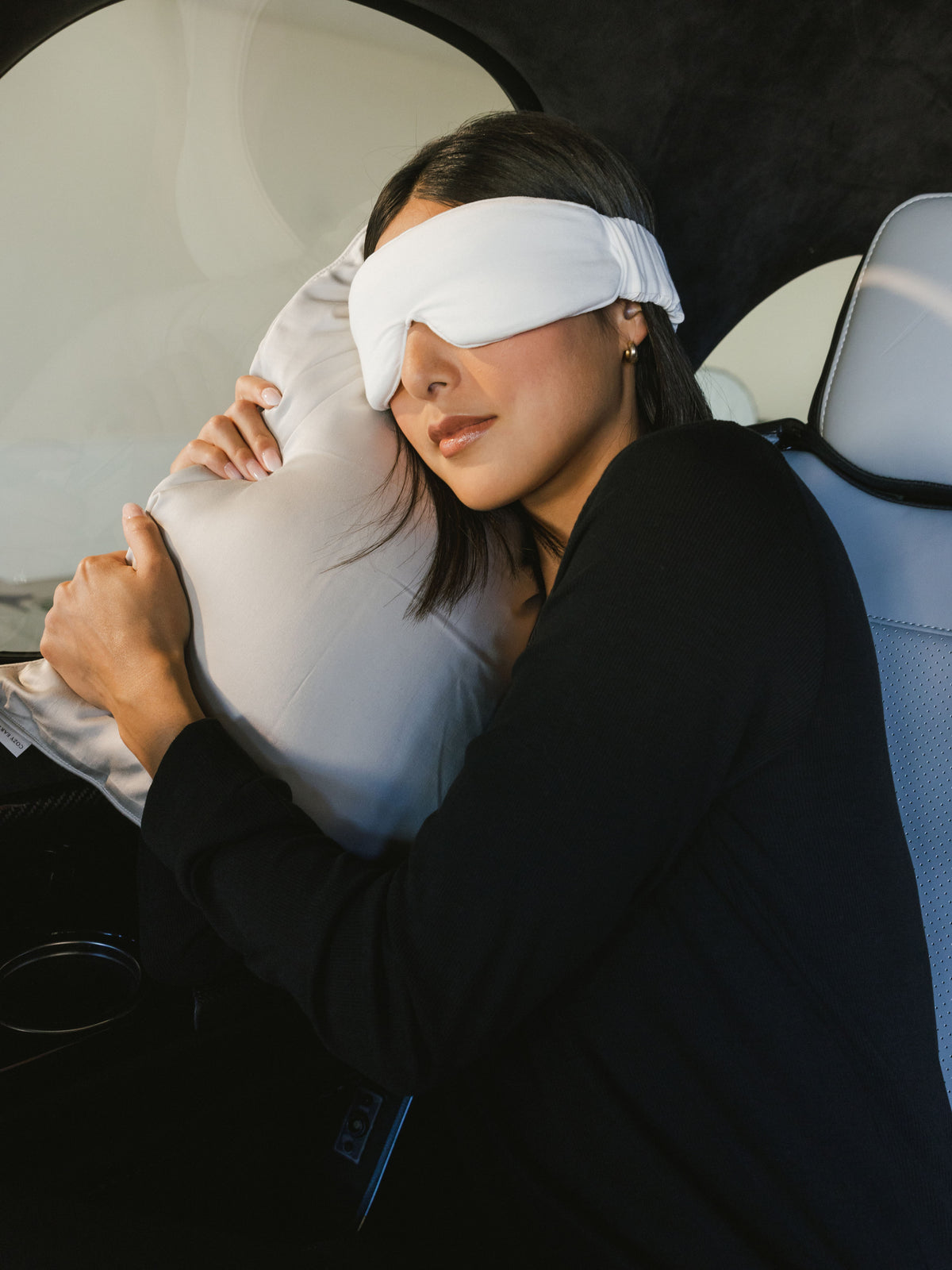 Woman with face mask in airplane using travel pillow |Size:Travel