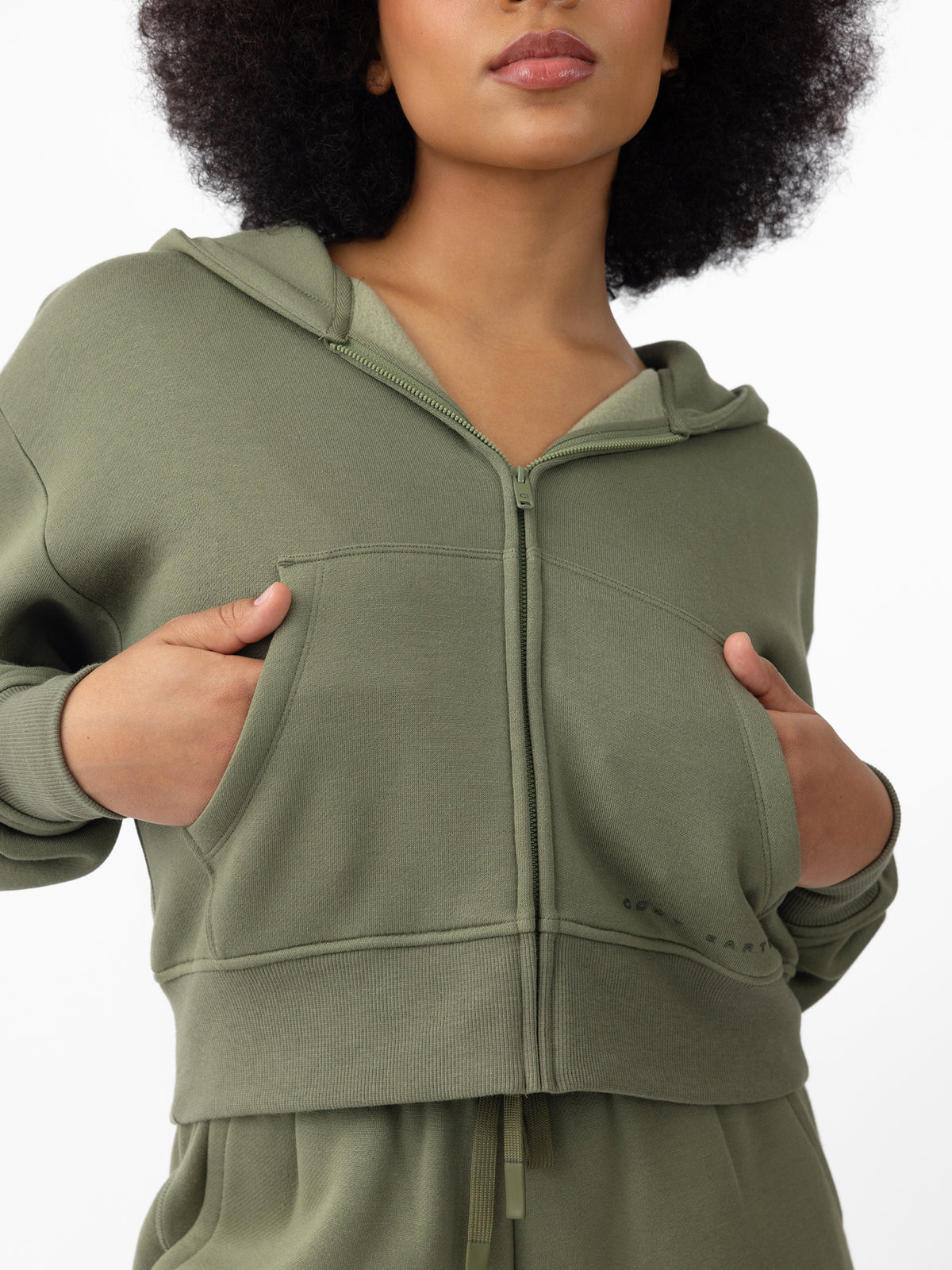 Woman wearing Juniper CityScape Cropped Full Zip with white background 