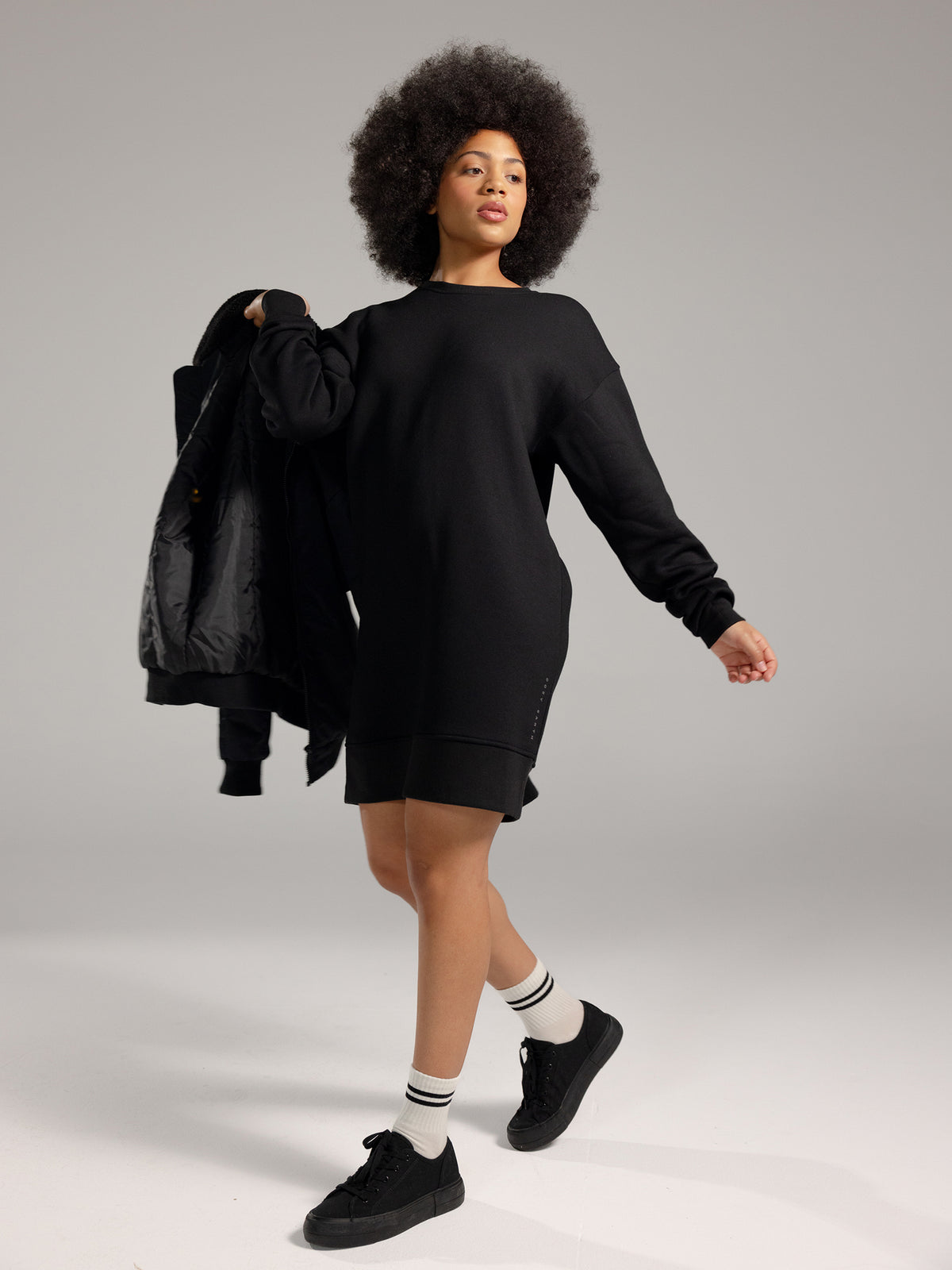 Woman wearing Black CityScape Crewneck Dress with grey background 