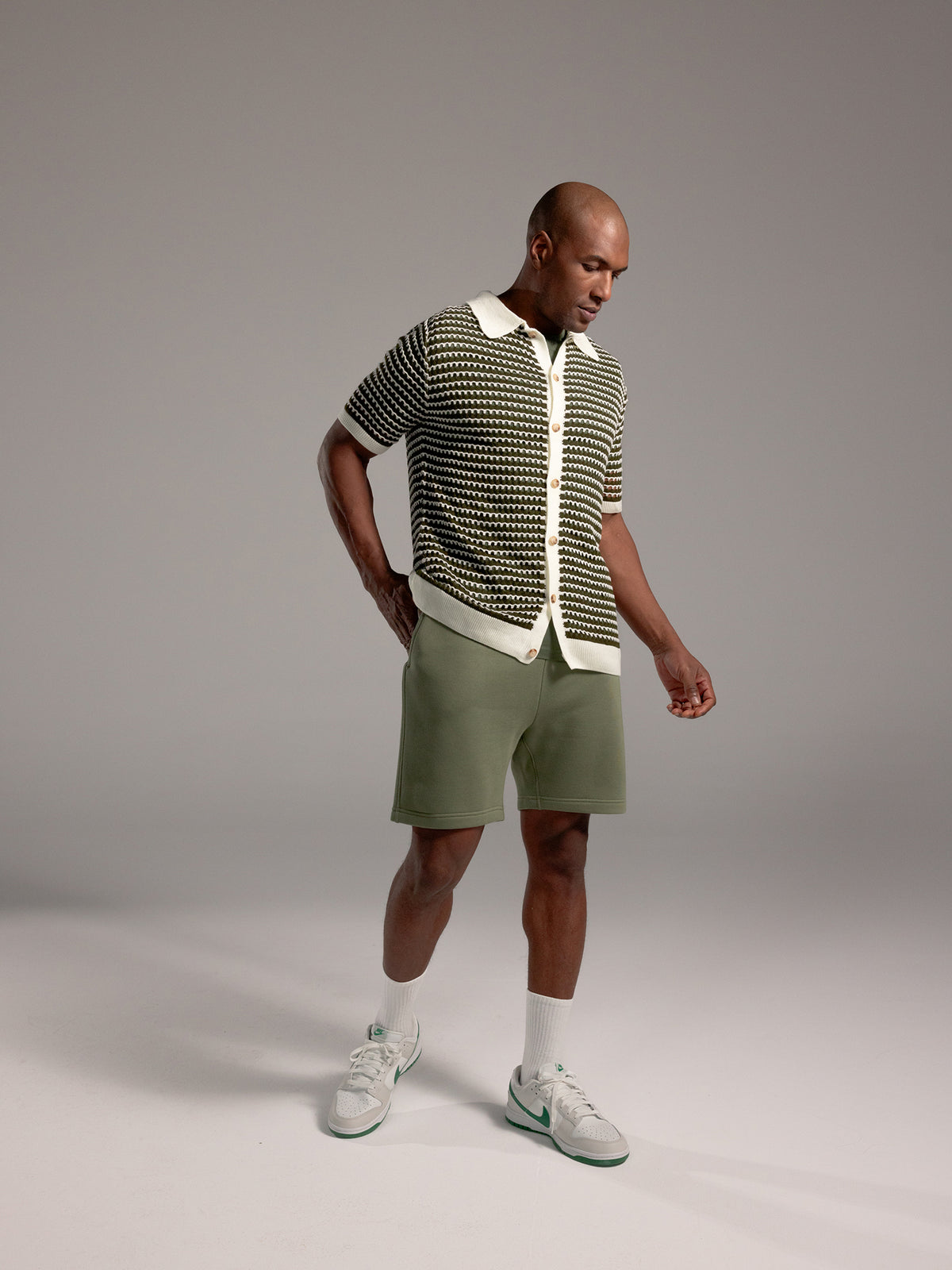 Man wearing Juniper CityScape Shorts with grey background 