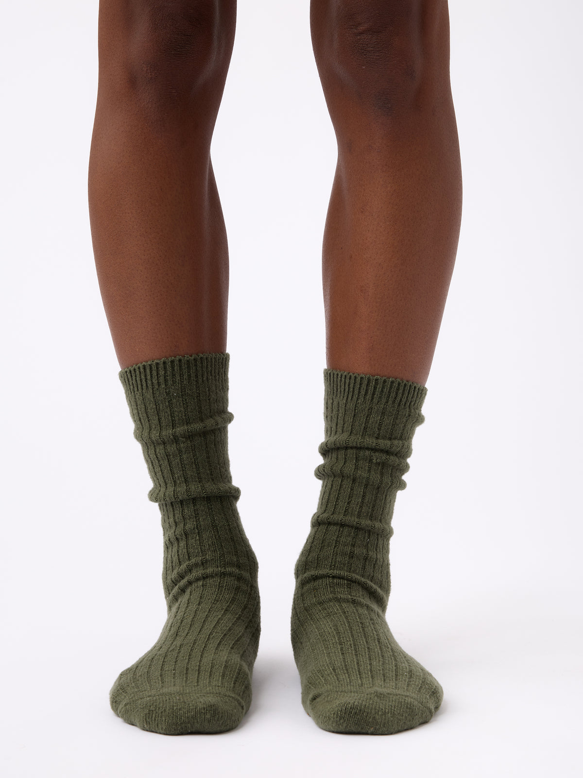 Person wearing Cozy Earth Plush Lounge Calf Sock in Olive 
