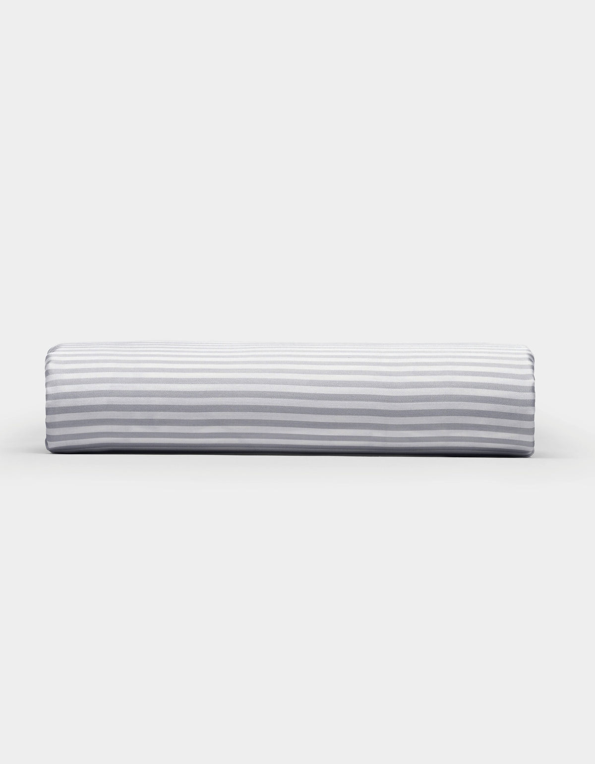 A Bamboo Fitted Sheet by Cozy Earth, featuring a light gray and white horizontal striped pattern, photographed on a plain white background.