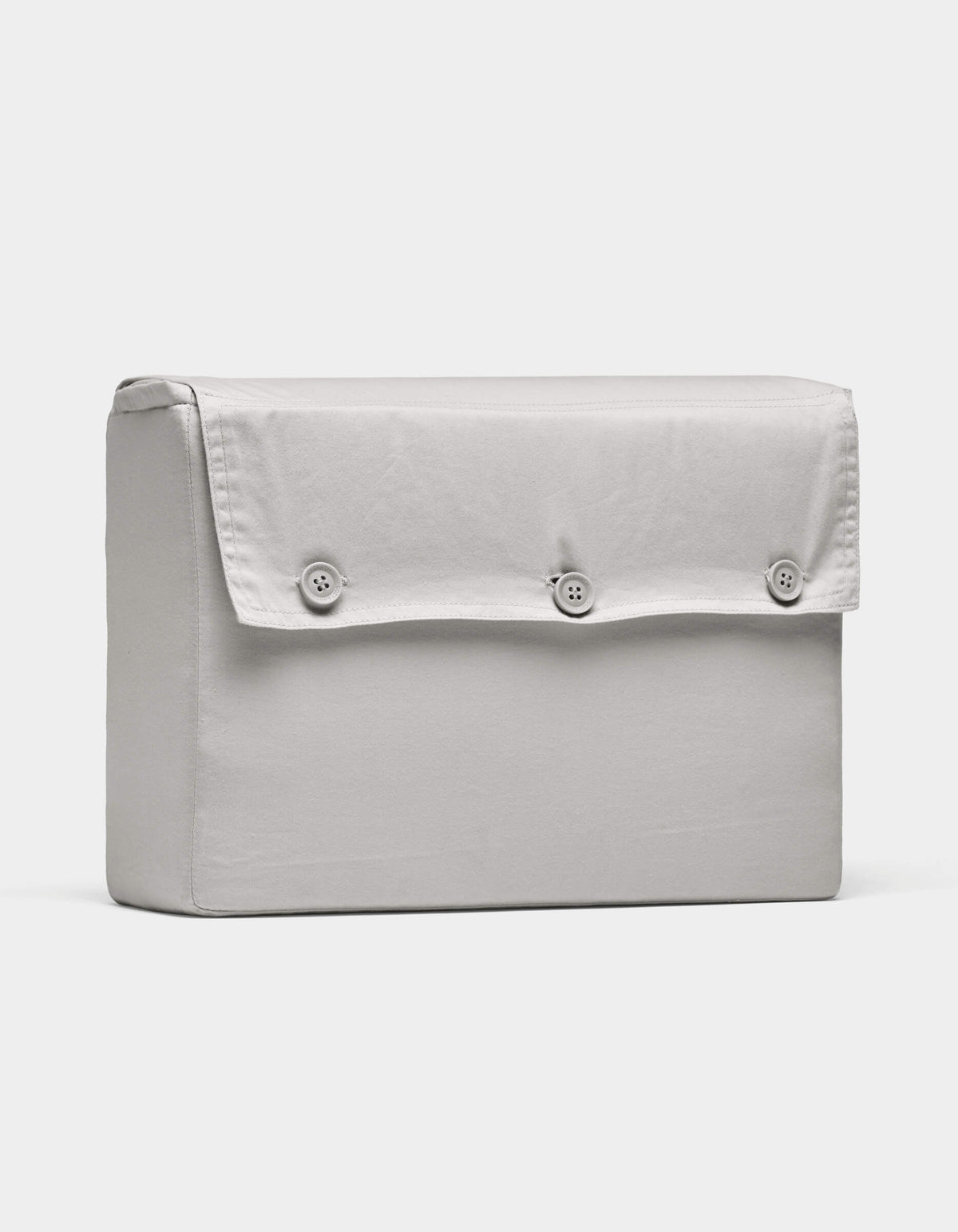 The Cozy Earth Soft-Wash Cotton Sheet Set, shown in light gray, is neatly arranged upright against a plain white background.