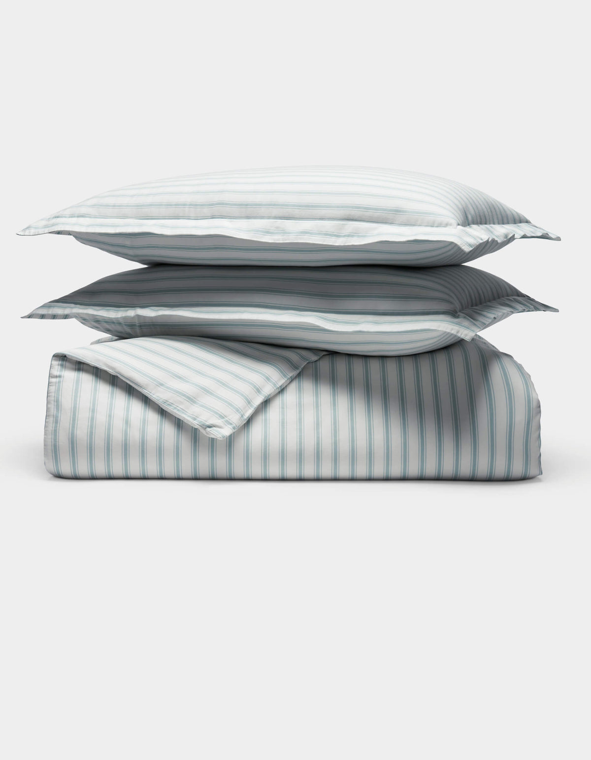 The Cozy Earth Soft-Wash Cotton Duvet Set is displayed neatly folded with two stacked pillows and a comforter, all in a light blue and white vertical striped pattern, set against a plain white background.